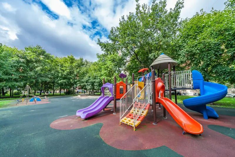 Best Surface Materials For Outdoor Playgrounds 4 Canva Colorful playground equipment