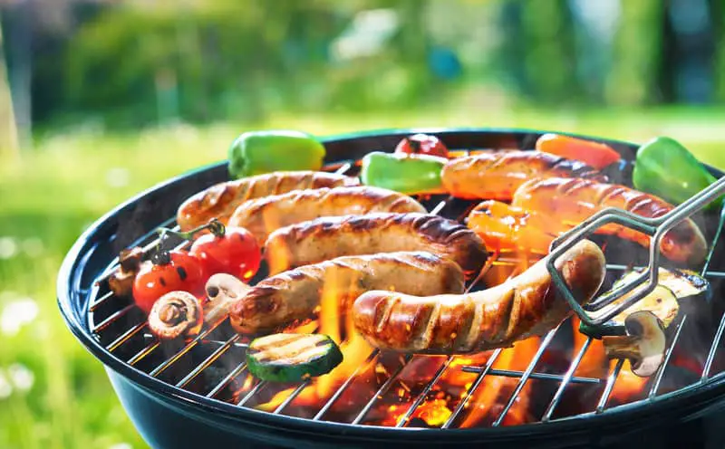 Canva Grilled sausage on the flaming grill