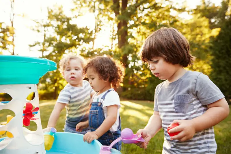Canva Group of Young Children Playing with Water