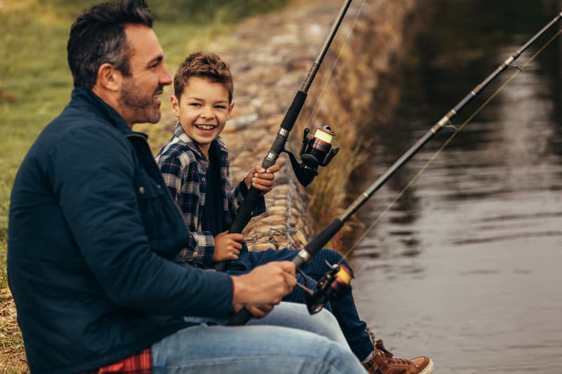Canva Happy Man and Kid Fishing in a Lake